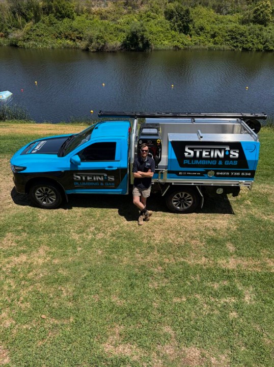Steins Plumbing & Gas owner with the company vehicle by the Clarence River