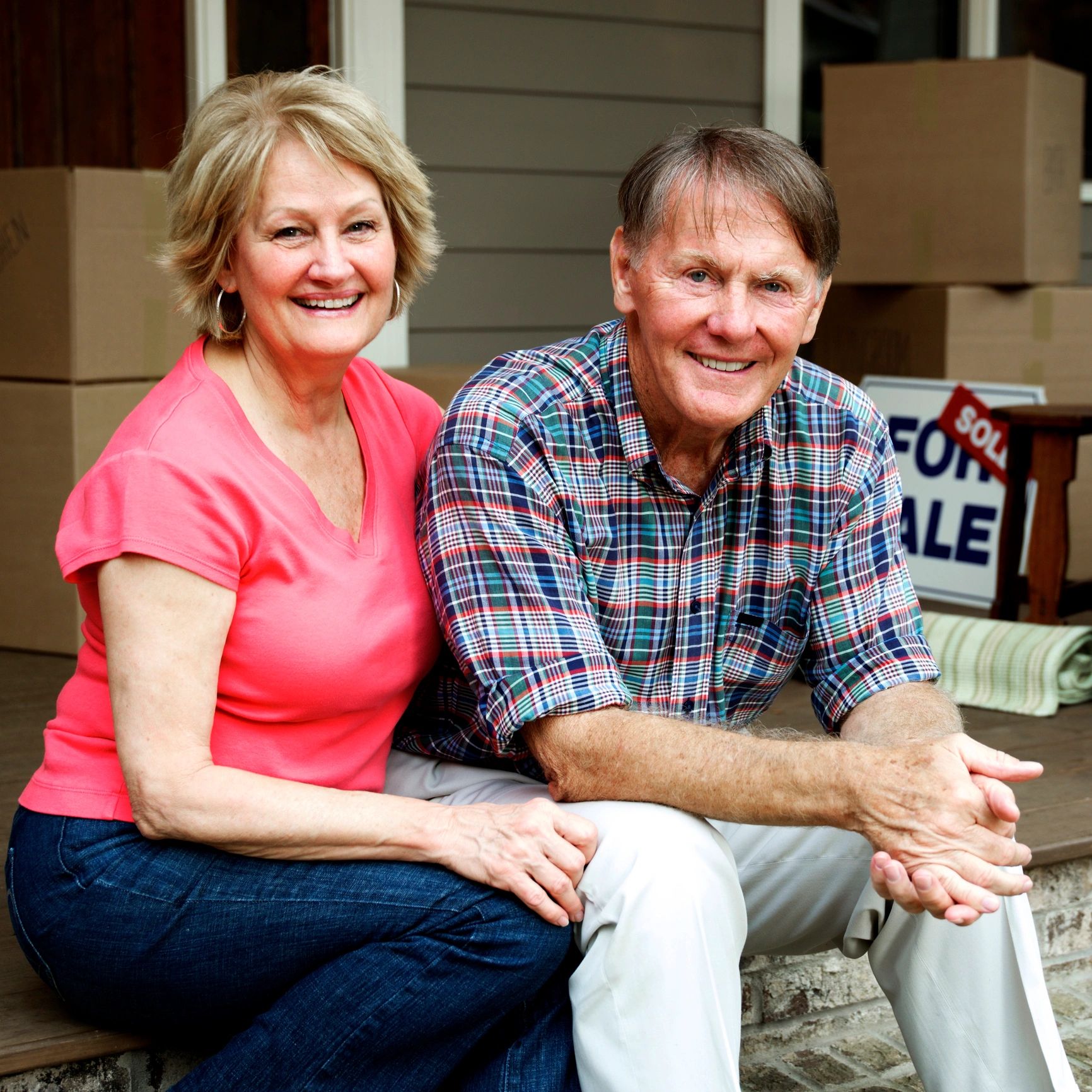 Senior couple outside their home